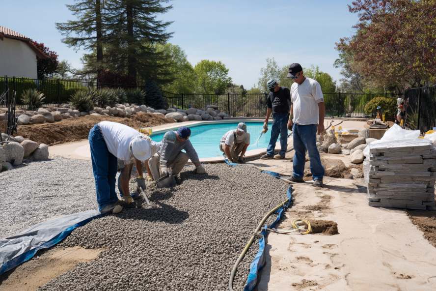 Pavers and decking around a finished Arizona pool